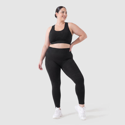 Woman wearing Sculpt 3D™ anti-cellulite leggings in black, front view, high-waisted fit