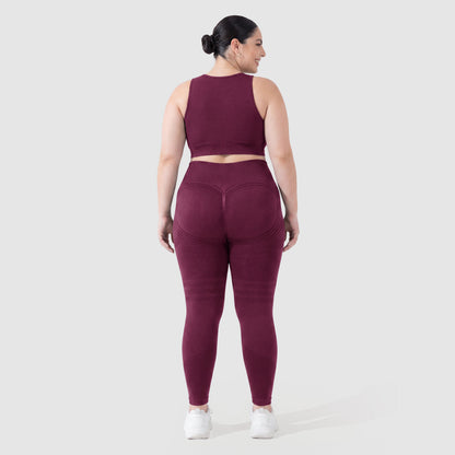 Woman wearing Sculpt 3D™ anti-cellulite leggings in plum, back view, lifted, contoured rear