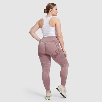 Woman wearing Sculpt 3D™ anti-cellulite leggings in pink, back view, lifted, contoured rear