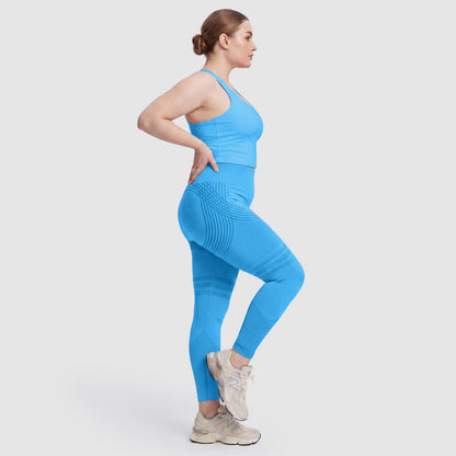 Woman wearing Sculpt 3D™ anti-cellulite leggings in turquoise, side view, showing the 3D sculpt lines