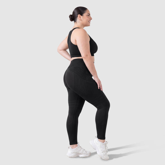 Woman wearing Sculpt 3D™ anti-cellulite leggings in black, side view, showing the 3D sculpt lines