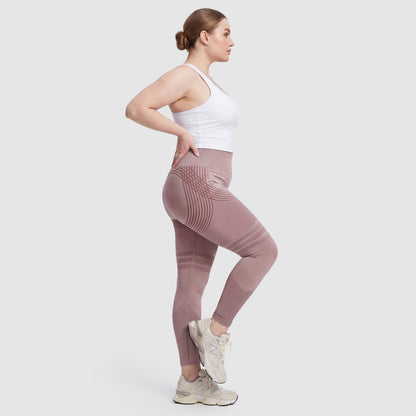 Woman wearing Sculpt 3D™ anti-cellulite leggings in pink, side view, showing the 3D sculpt lines