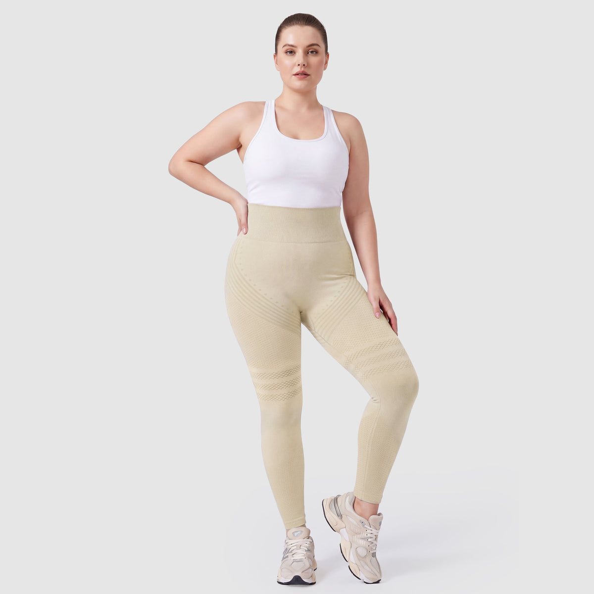 Woman wearing Sculpt 3D™ anti-cellulite leggings in beige, front view, high-waisted fit