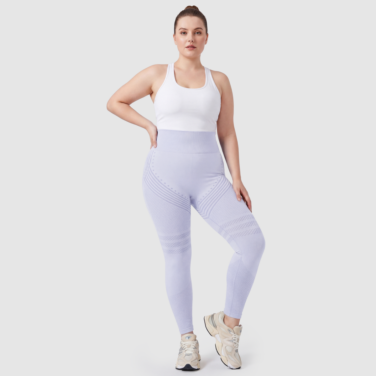 Woman wearing Sculpt 3D™ anti-cellulite leggings in light blue, front view, high-waisted fit