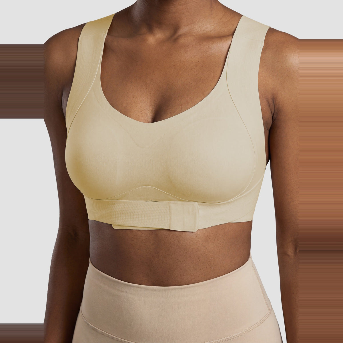 Close-up of the front-closure band on the Sculpt posture bra in beige