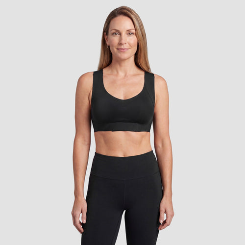 Woman wearing the Sculpt wireless posture bra in black, front view